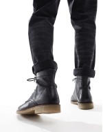 lace up boots in black leather with natural sole